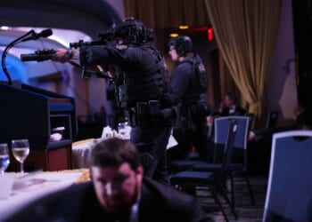 Agents stand guard after a shooting took place at the White House Correspondents' dinner at the Washington Hilton in Washington, DC on April 25, 2026.